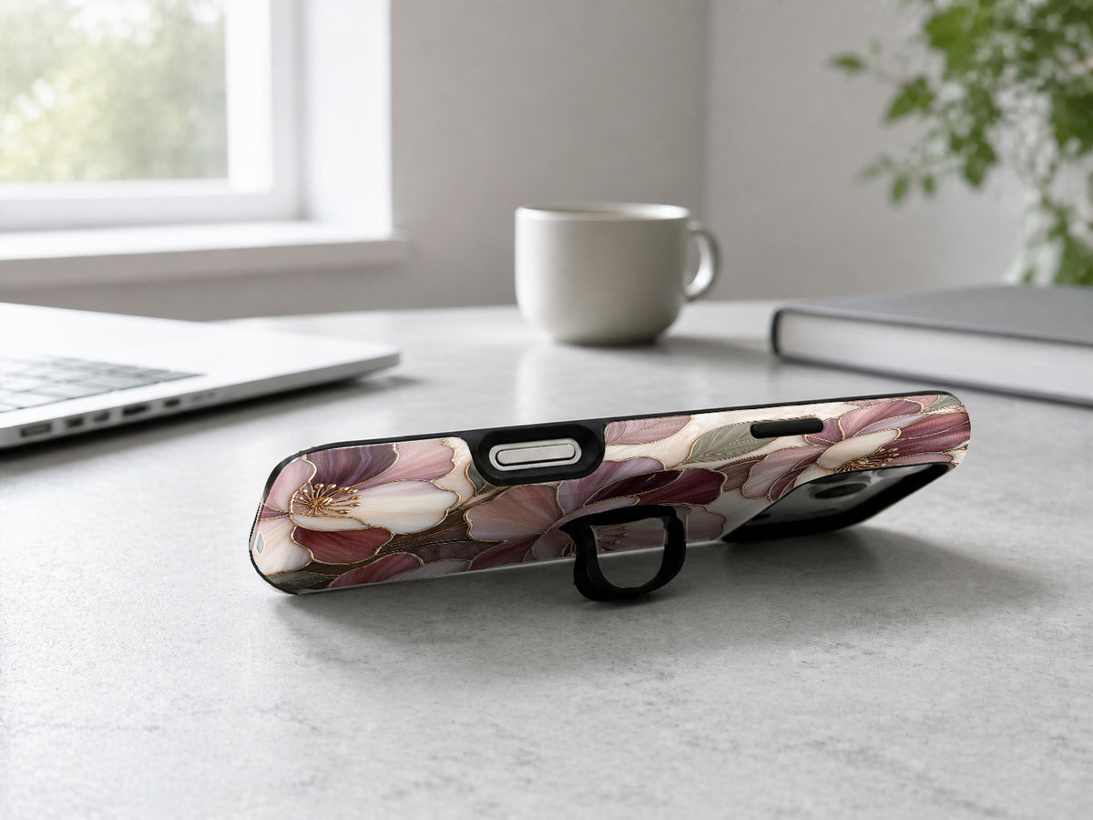 Dusty Rose Magnolia Floral MagSafe Loop iPhone Case shown in a neutral white professional lifestyle setting