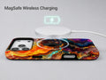 Fiery Agate Marble MagSafe Loop iPhone Case shown with a MagSafe-compatible wireless charger attached