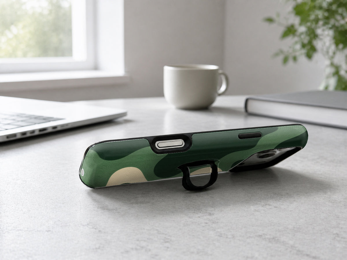 Forest Green Abstract Wave MagSafe Loop iPhone Case shown in a neutral white professional lifestyle setting