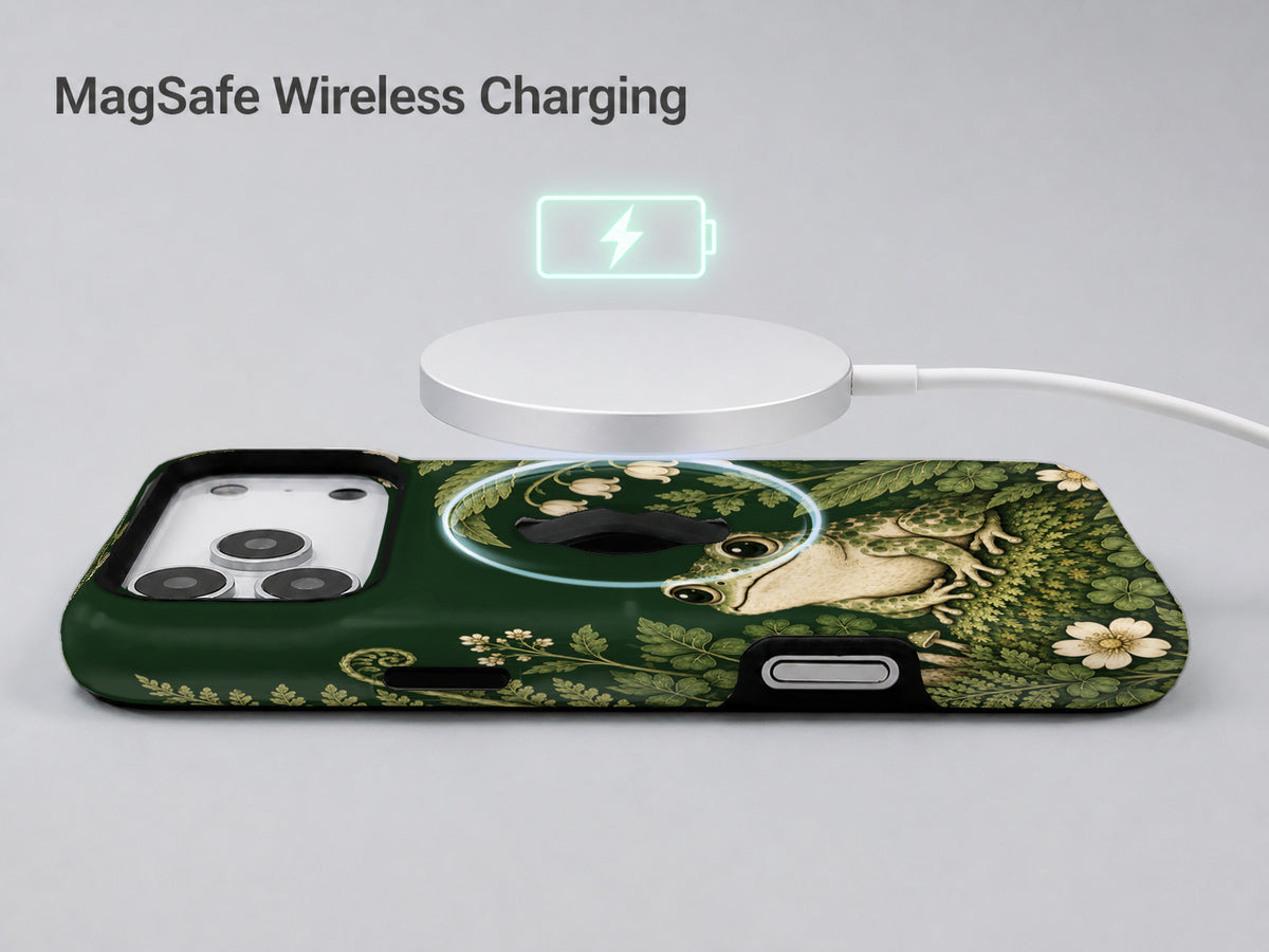 Forest Green Frog and Mushroom Garden MagSafe Loop iPhone Case, shown with a MagSafe wireless charger