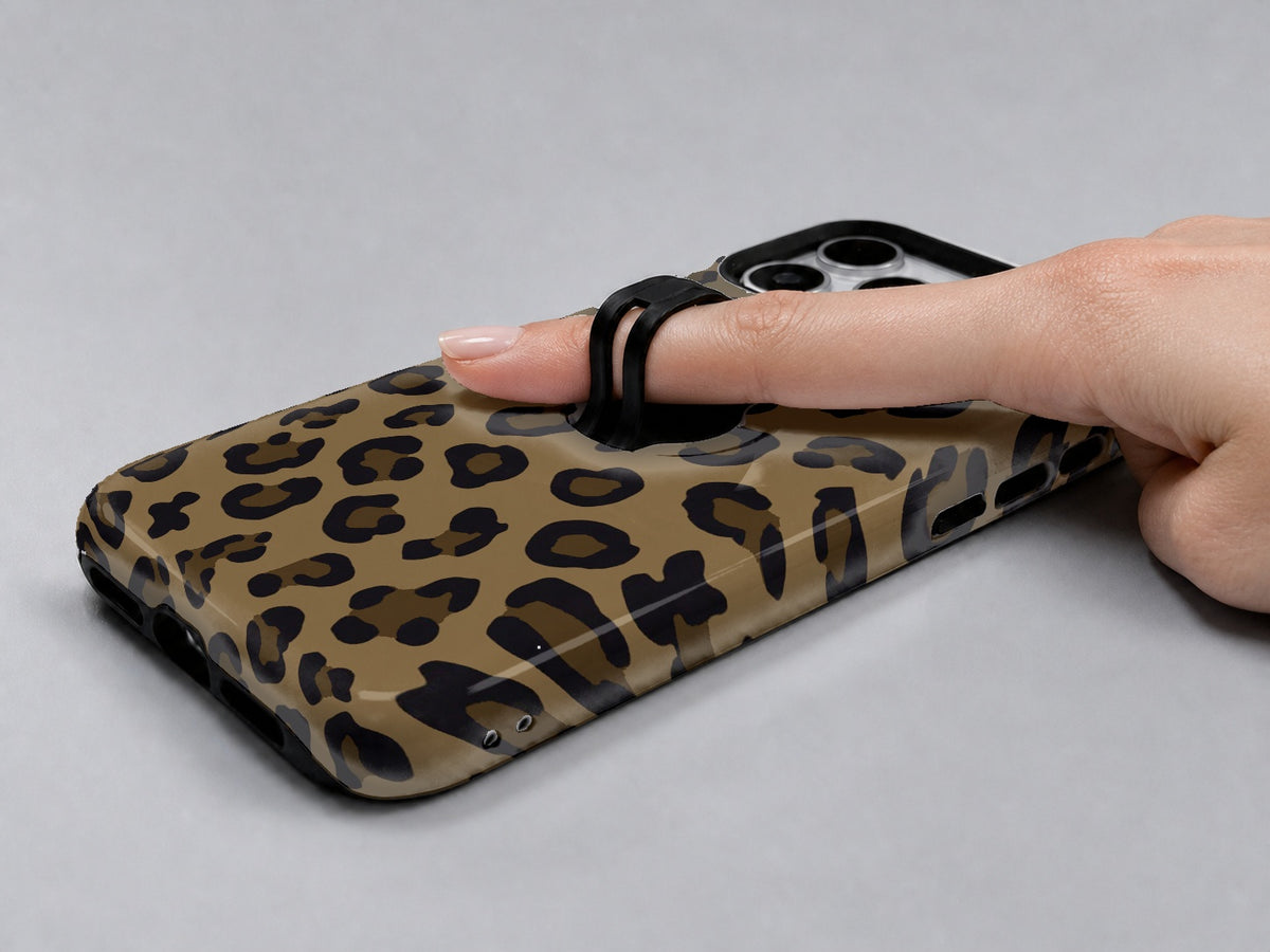 Golden Leopard Print MagSafe Loop iPhone Case shown in use with a finger through the horizontal loop