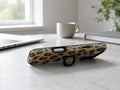 Golden Leopard Print MagSafe Loop iPhone Case shown in a neutral white professional lifestyle setting