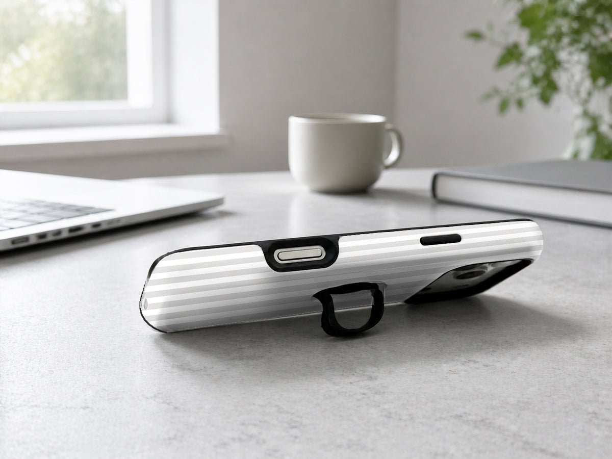 Gray Pinstripe MagSafe Loop iPhone Case shown in a neutral white professional lifestyle setting
