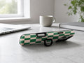 Green Cream Checkerboard MagSafe Loop iPhone Case shown in a neutral white professional lifestyle setting