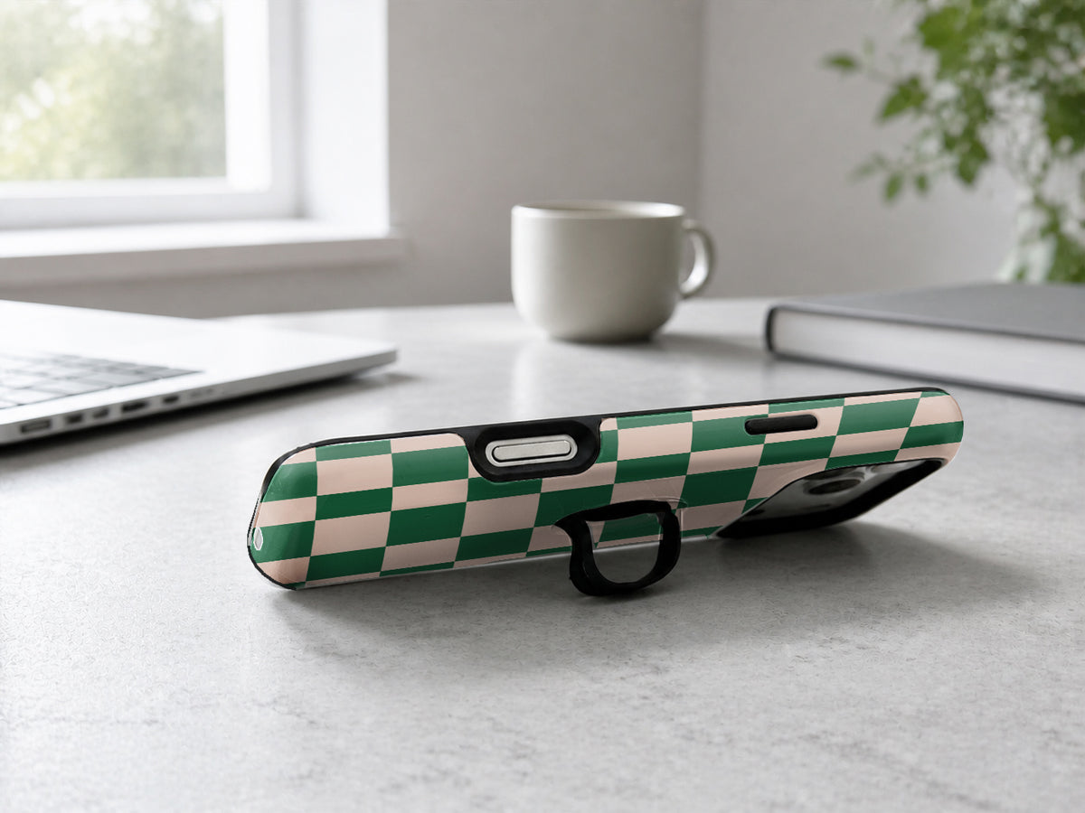 Green Cream Checkerboard MagSafe Loop iPhone Case shown in a neutral white professional lifestyle setting