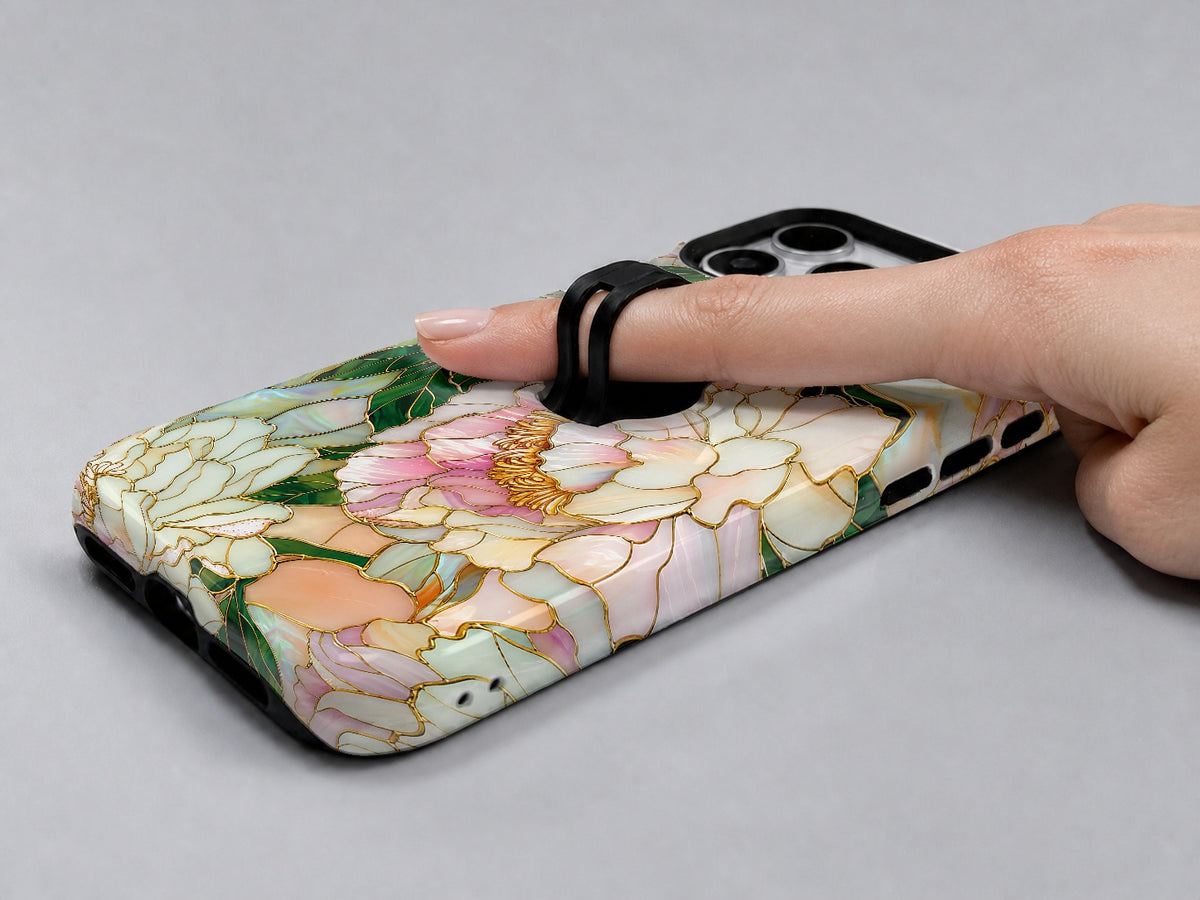 Green Peach Stained Glass Floral MagSafe Loop iPhone Case shown in use with a finger through the horizontal loop