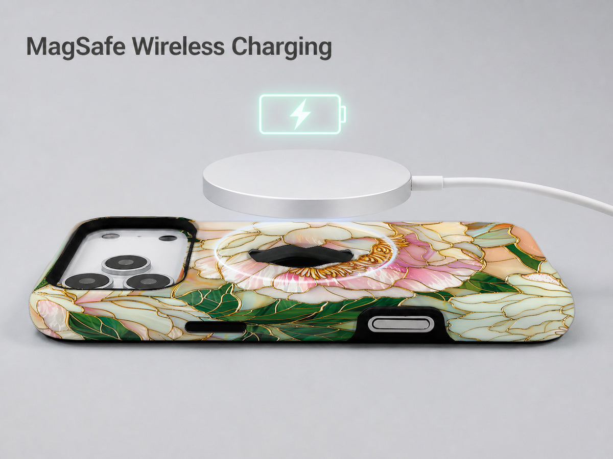 Green Peach Stained Glass Floral MagSafe Loop iPhone Case shown with a MagSafe-compatible wireless charger attached