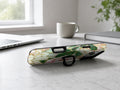 Green Peach Stained Glass Floral MagSafe Loop iPhone Case shown in a neutral white professional lifestyle setting