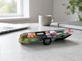 Jewel Tone Stained Glass Floral MagSafe Loop iPhone Case shown in a neutral white professional lifestyle setting