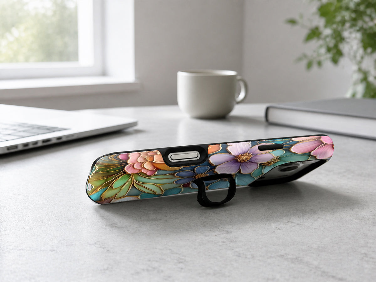 Jewel Tone Stained Glass Floral MagSafe Loop iPhone Case shown in a neutral white professional lifestyle setting