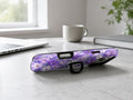 Lavender Daisy Floral MagSafe Loop iPhone Case shown in a neutral white professional lifestyle setting