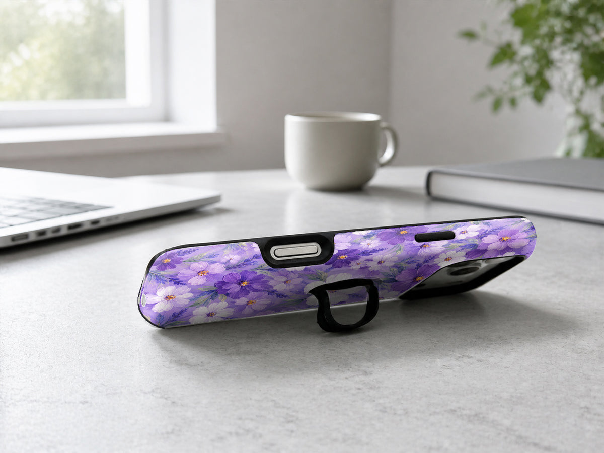 Lavender Daisy Floral MagSafe Loop iPhone Case shown in a neutral white professional lifestyle setting