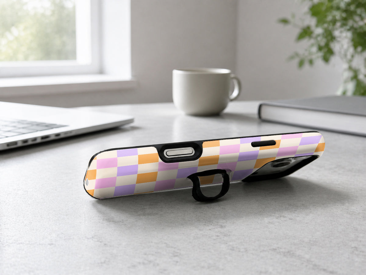 Lavender Peach Checkerboard MagSafe Loop iPhone Case shown in a neutral white professional lifestyle setting