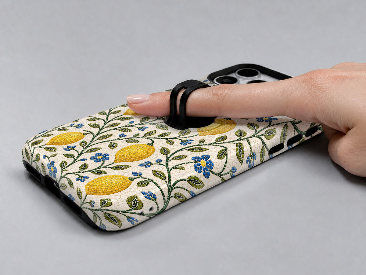Lemon Botanical MagSafe Loop iPhone Case shown in use with a finger through the horizontal loop