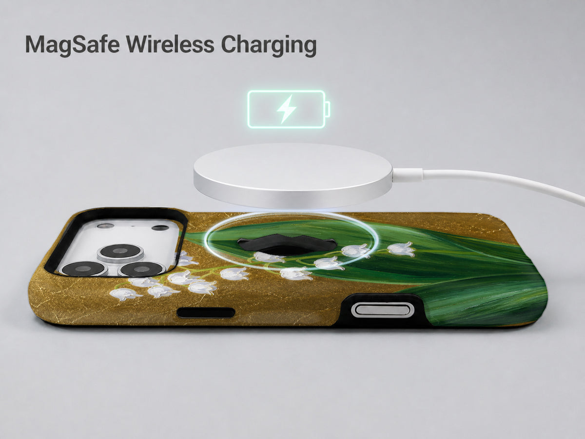 Lily of the Valley on Gold MagSafe Loop iPhone Case shown with a MagSafe-compatible wireless charger attached
