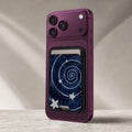 Midnight Blue Celestial Spiral MagSafe Card Holder, attached to a compatible phone