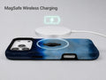 Midnight Navy Sky Blue Color Block MagSafe Loop iPhone Case shown with a MagSafe-compatible wireless charger attached