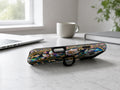 Midnight Ornate Jewel Floral MagSafe Loop iPhone Case shown in a neutral white professional lifestyle setting