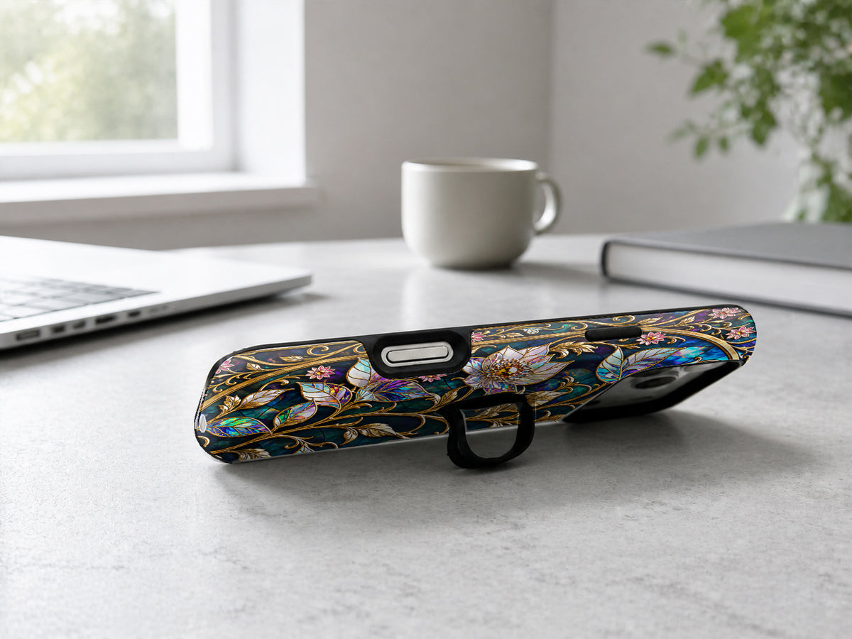 Midnight Ornate Jewel Floral MagSafe Loop iPhone Case shown in a neutral white professional lifestyle setting