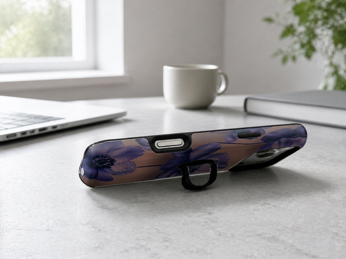 Midnight Purple Floral MagSafe Loop iPhone Case shown in a neutral white professional lifestyle setting