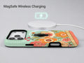 Mint Retro Folk Floral MagSafe Loop iPhone Case shown with a MagSafe-compatible wireless charger attached