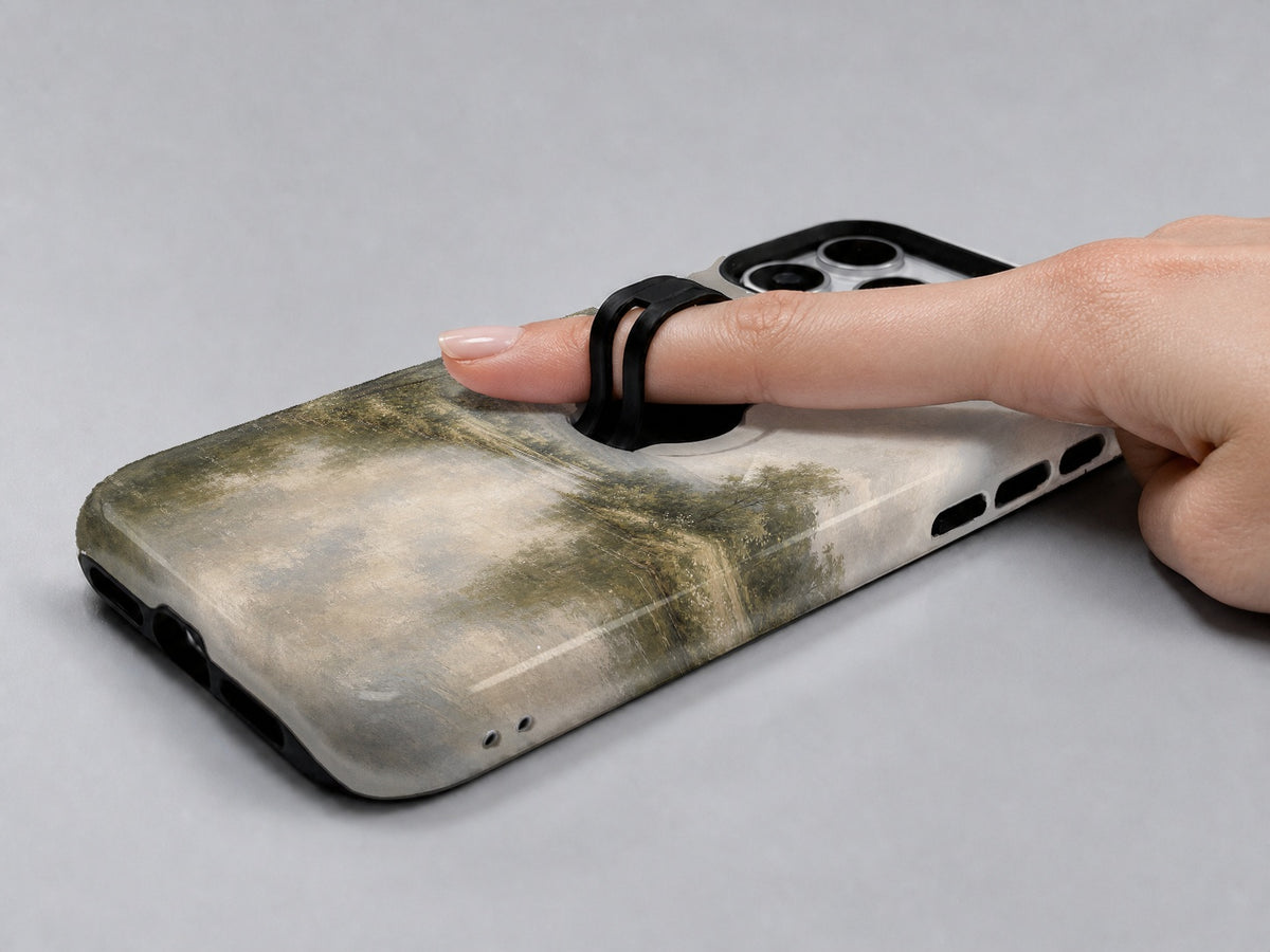 Misty Neutral Landscape MagSafe Loop iPhone Case shown in use with a finger through the horizontal loop