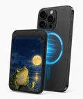 Moonlit Frog by the Lake MagSafe Card Holder, magnetic attachment to a compatible iPhone