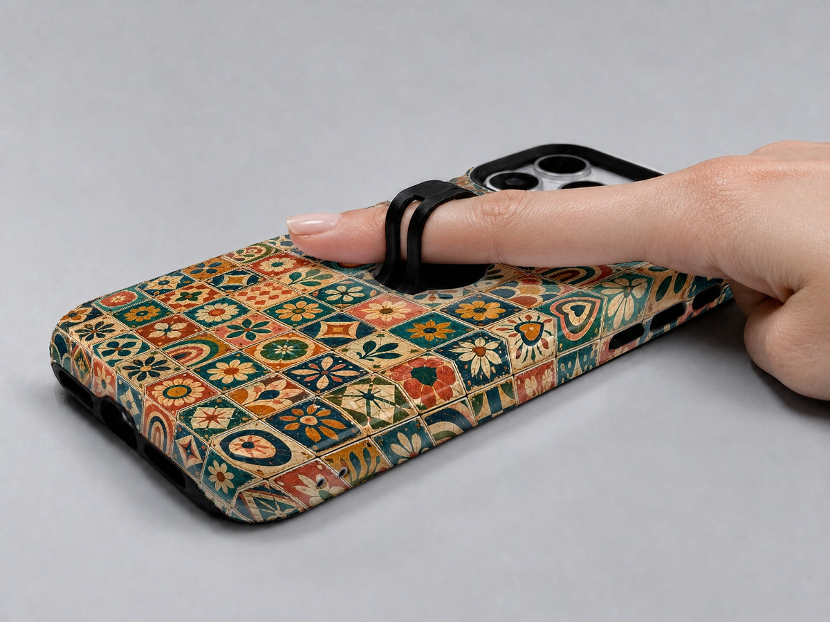 Moroccan Mosaic Tile MagSafe Loop iPhone Case shown in use with a finger through the horizontal loop