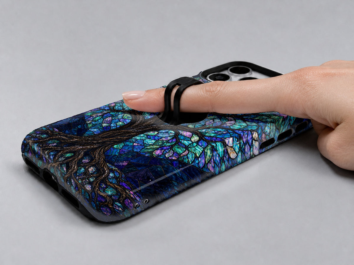 Mystical Tree of Life MagSafe Loop iPhone Case shown in use with a finger through the horizontal loop