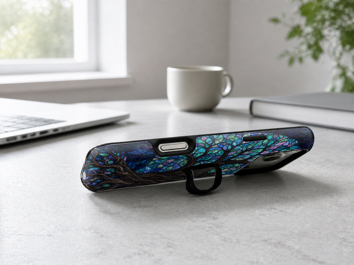 Mystical Tree of Life MagSafe Loop iPhone Case shown in a neutral white professional lifestyle setting