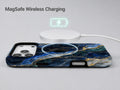 Navy Gold Marble MagSafe Loop iPhone Case shown with a MagSafe-compatible wireless charger attached