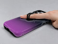 Navy Purple Ombre Gradient MagSafe Loop iPhone Case shown in use with a finger through the horizontal loop