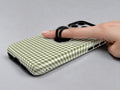Olive Green and White Gingham MagSafe Loop Case, shown with a finger through the loop