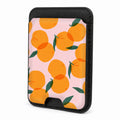 Front view of the Orange Fruit on Pink MagSafe card holder on a white background