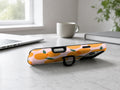Orange Fruit on Pink MagSafe Loop iPhone Case shown in a neutral white professional lifestyle setting