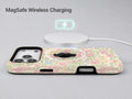 Pastel Cottage Garden Floral MagSafe Loop iPhone Case shown with a MagSafe-compatible wireless charger attached