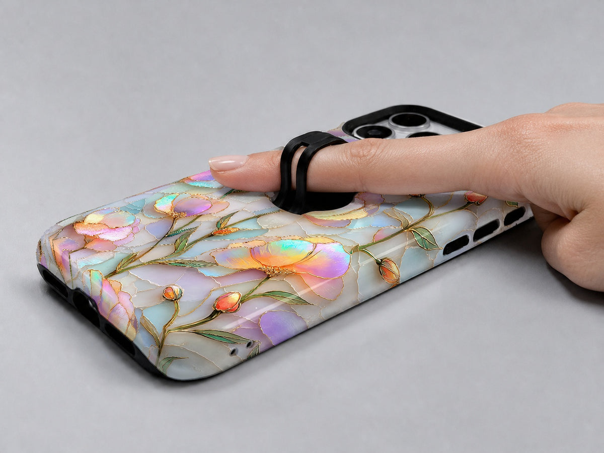 Pastel Tulip Stained Glass MagSafe Loop iPhone Case shown in use with a finger through the horizontal loop