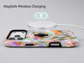 Pastel Tulip Stained Glass MagSafe Loop iPhone Case shown with a MagSafe-compatible wireless charger attached