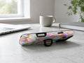 Pastel Tulip Stained Glass MagSafe Loop iPhone Case shown in a neutral white professional lifestyle setting