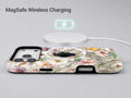 Pastel Wildflower Stained Glass MagSafe Loop iPhone Case shown with a MagSafe-compatible wireless charger attached