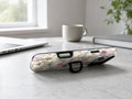 Pastel Wildflower Stained Glass MagSafe Loop iPhone Case shown in a neutral white professional lifestyle setting