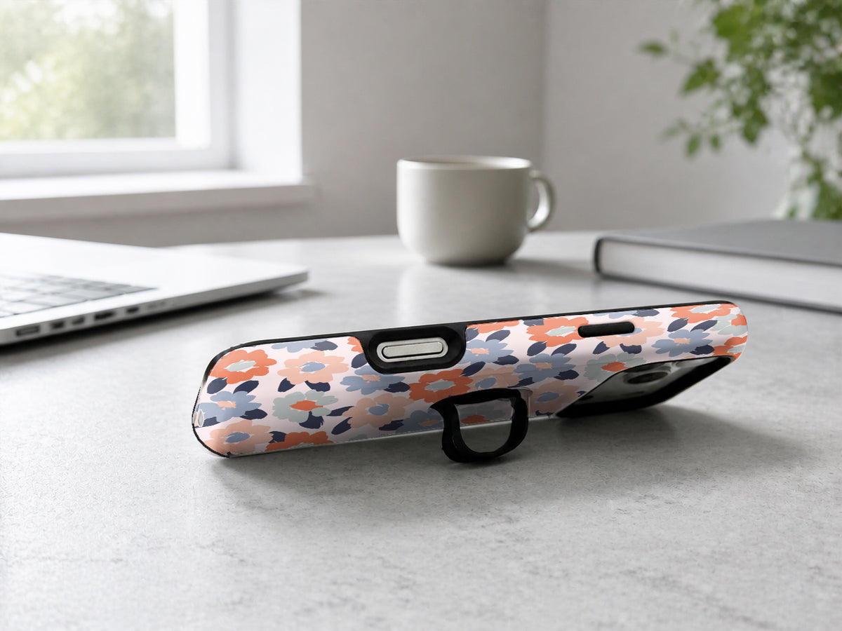 Peach Blue Abstract Leopard MagSafe Loop iPhone Case shown in a neutral white professional lifestyle setting