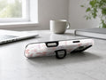 Pink Coquette Bow Toile MagSafe Loop iPhone Case shown in a neutral white professional lifestyle setting