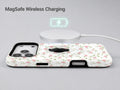 Pink Ditsy Floral MagSafe Loop iPhone Case shown with a MagSafe-compatible wireless charger attached