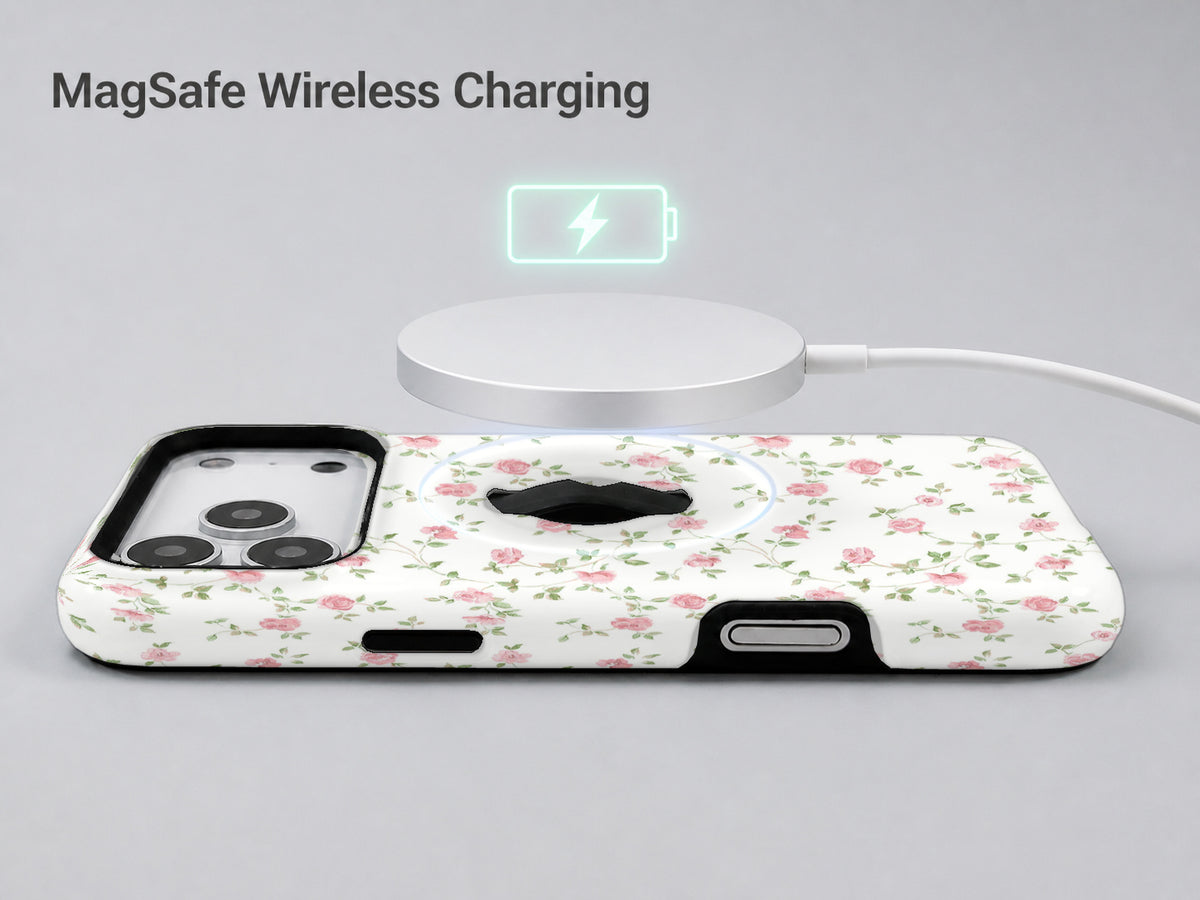 Pink Ditsy Floral MagSafe Loop iPhone Case shown with a MagSafe-compatible wireless charger attached