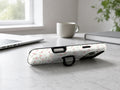 Pink Ditsy Floral MagSafe Loop iPhone Case shown in a neutral white professional lifestyle setting