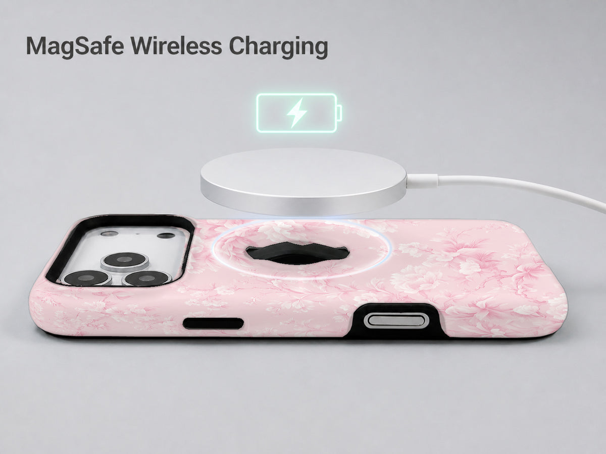 Pink Toile Floral MagSafe Loop iPhone Case shown with a MagSafe-compatible wireless charger attached