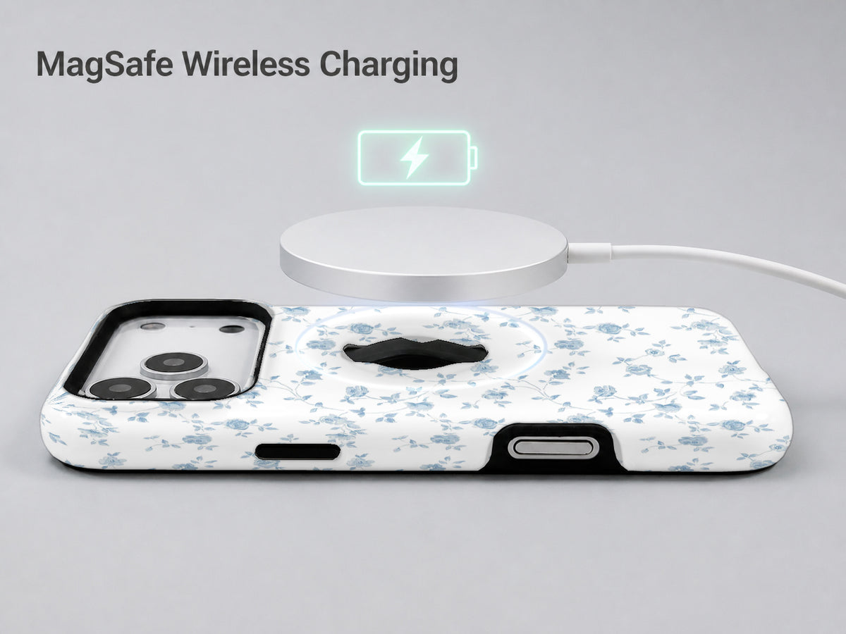 Powder Blue Ditsy Floral MagSafe Loop iPhone Case shown with a MagSafe-compatible wireless charger attached