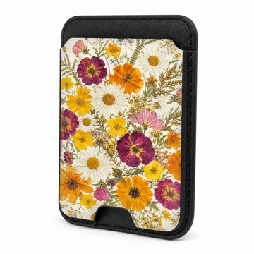 Front view of the Pressed Daisy Wildflower Bouquet MagSafe card holder on a white background