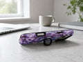 Purple Watercolor Flower Field MagSafe Loop iPhone Case shown in a neutral white professional lifestyle setting